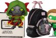 A Doctor Doom Funko Pop figure, a Loungefly backpack with a circular front pocket, and a Green Lantern Funko Pop figure, all released for NYCC 2026.